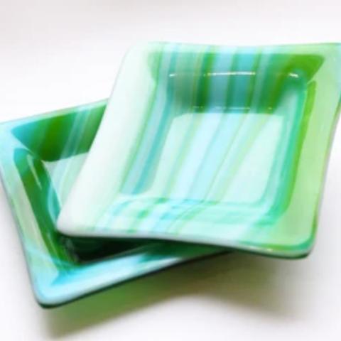 Green striped dishes that have been slumped