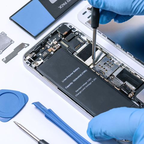 Closeup of person repairing a smartphone