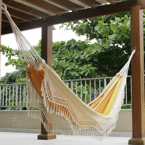 Hang a hammock on a porch with sturdy beams..