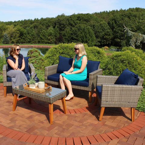 2 friends enjoying the sun and conversation on a comfortable patio set