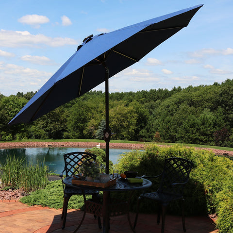 tilted umbrella to shade an outdoor patio table set