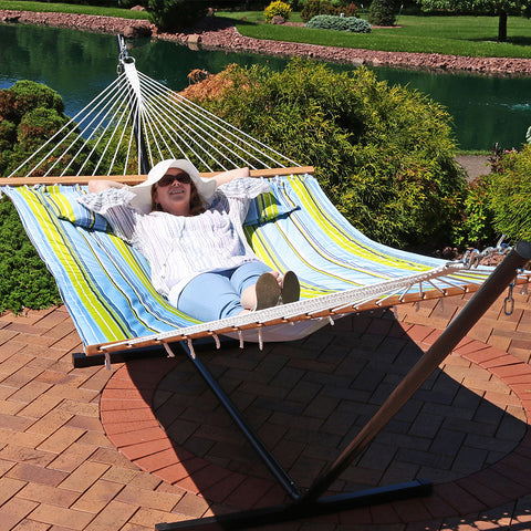 Woman relaxing in hammock on a sunny day