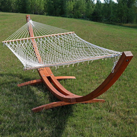 Classic rope hammock with wooden hammock displayed on the lawn.