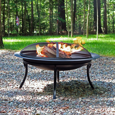 Portable fire pit being used for camping