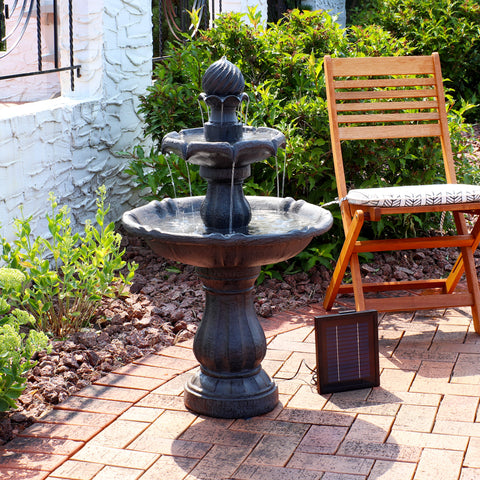 Tiered fountain set up on a deck 