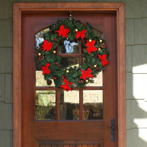 Adding a Christmas wreath to your door is a great way to decorative your room for Christmas