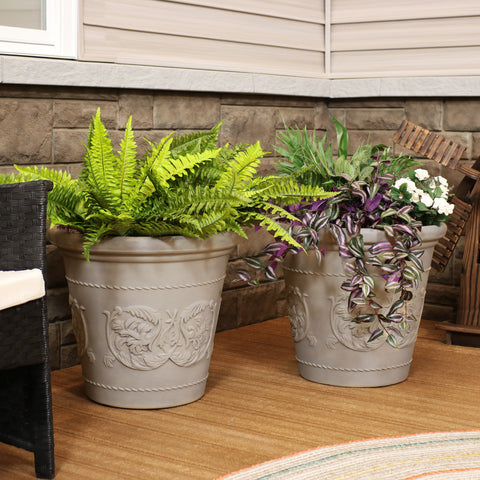Large flower pot planters displayed on a small deck.