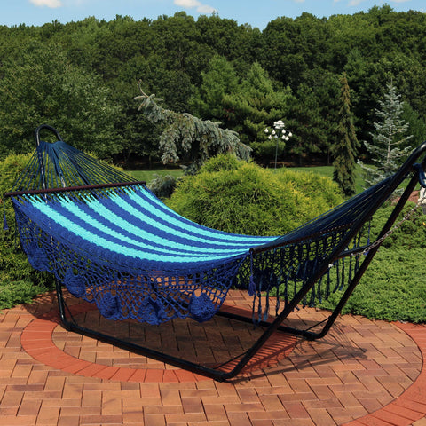 Traditional American style hammock with stand on the patio.