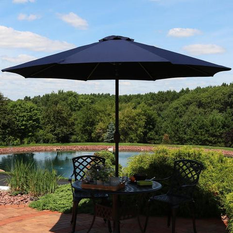 9 foot patio umbrella giving shade to a outdoor table.