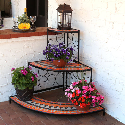 Tiered shelf holding planters on a patio