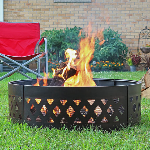 Fire burning in fire ring surrounded by chairs