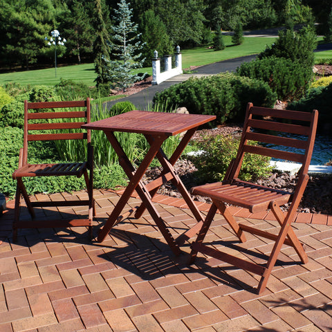 Bistro set on the paved patio on a beautiful day
