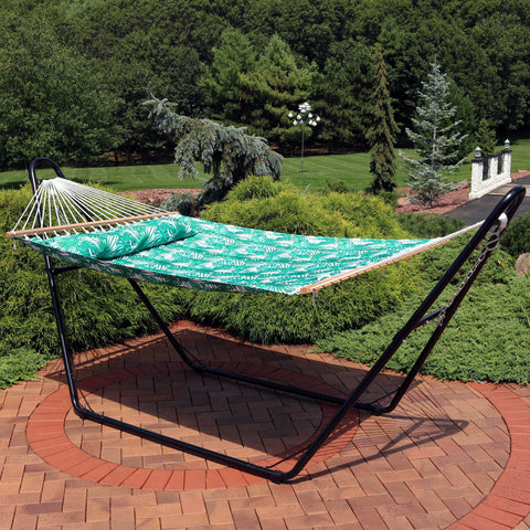 Quilted hammock with stand on the patio.