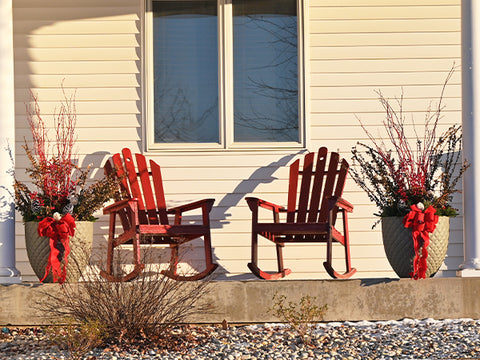 2 porch pots with red bows and greenery