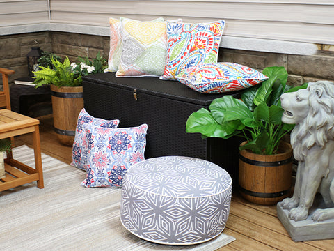 outdoor throw pillows on a deck box