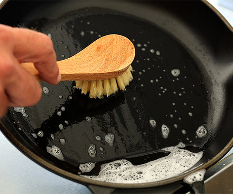 handwashing a cast iron pan