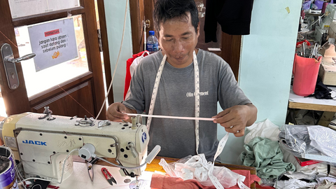 image of our production factory worker making garments