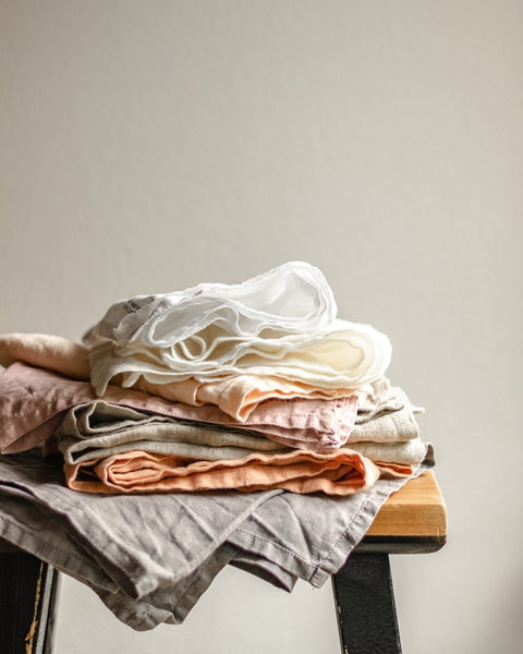 care for linen clothes - linen clothes folded one on top on another