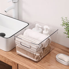 Clear acrylic bins for bathroom storage for towels and lotions