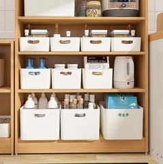 White plastic storage bins in kitchen and pantry cabinet