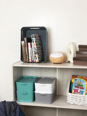 Glad grey plastic storage baskets as a mini bookshelf bookend