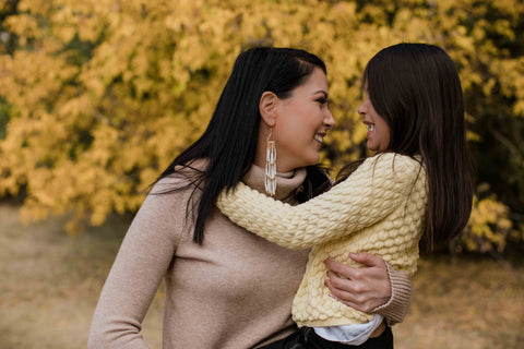 Mother and daughter enjoying a day out together in the park