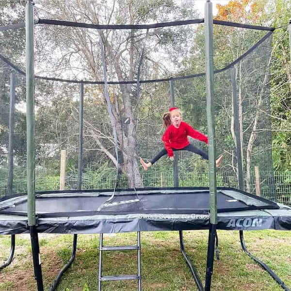 A little girl jumping on an ACON Trampoline.