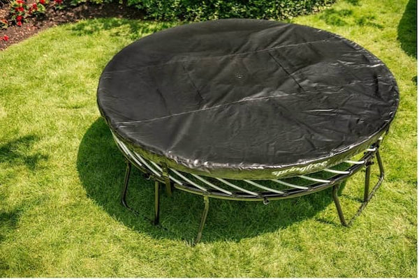 A Springfree Trampoline with a cover on the mat.