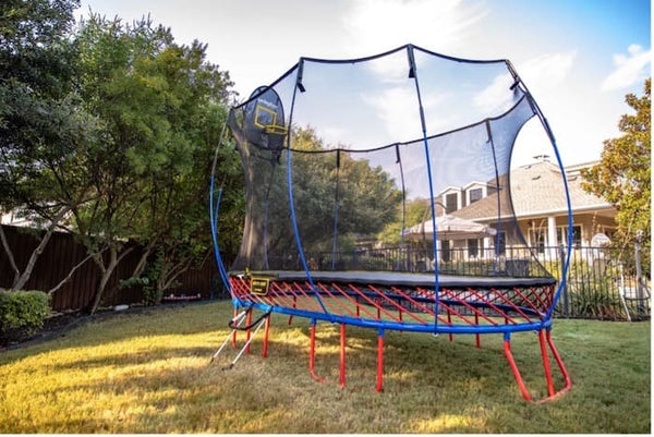 A blue and red Springfree Trampoline.