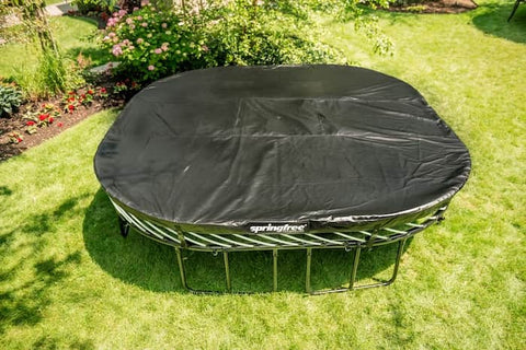 A Springfree Trampoline with a weather cover over the mat.