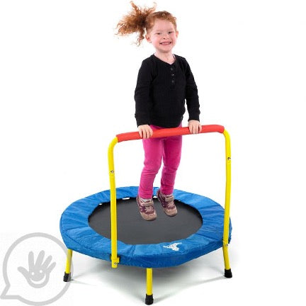 A young girl on a Fold-and-Go Indoor Trampoline.