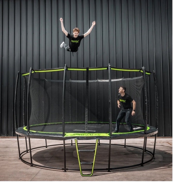 Two men jumping on a Jumpflex Trampoline.