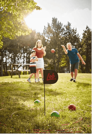 A family playing the Lob Home game.