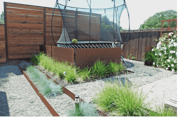 A Springfree Trampoline in a backyard.