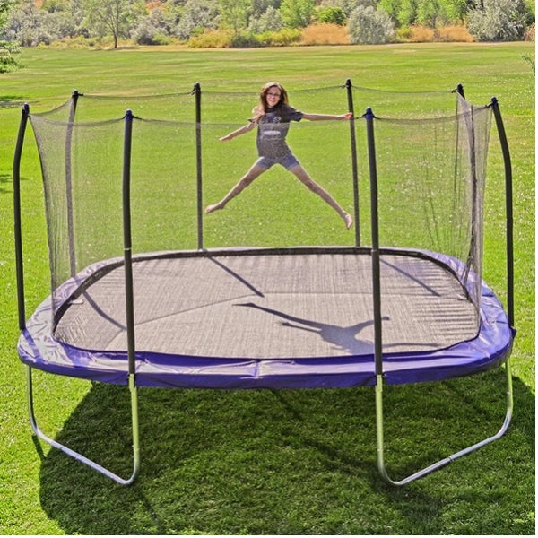 Kid jumping on a Skywalker Square Trampoline.