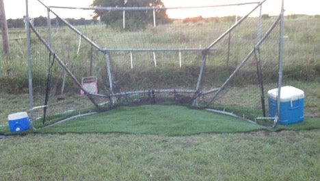 A trampoline frame turned into a backstop.