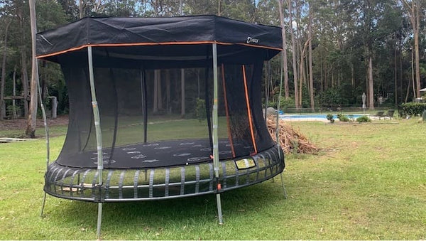 A Vuly Trampoline with a sunshade attached.