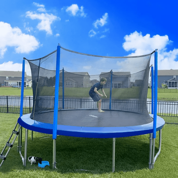 A boy jumping on a blue Zupapa Trampoline on a sunny day.