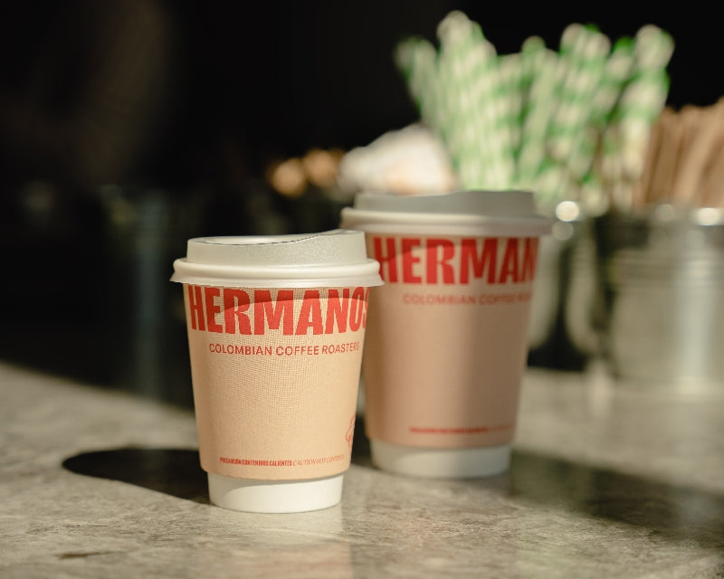 Hermanos Colombian Coffee Roasters branded takeaway coffee cups