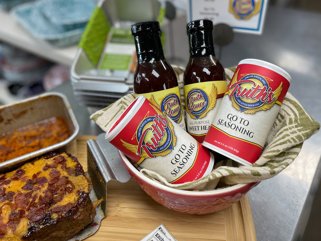 truth sauce seasoning stacked in a bowl next to a baked meatloaf