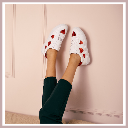 white leather trainers with red hearts