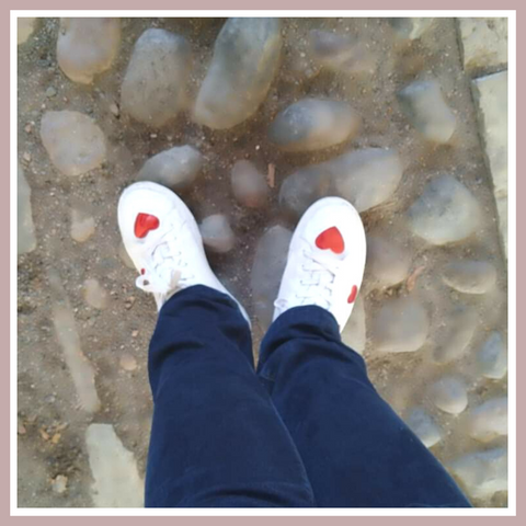 metallic red hearts against the classic white leather trainers with jeans