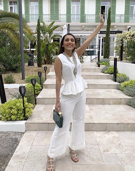 Influencer Masoom Minawala Mehta with L'alingi Emerald jasmina clutch in Cannes