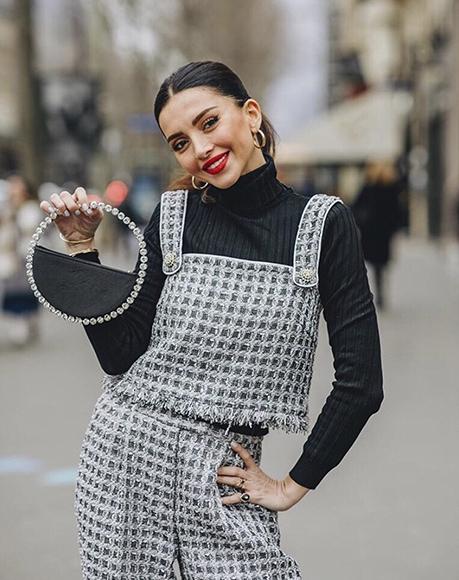 Influencer Nathalie Fanj with L'alingi black eternity clutch during Paris Fashion Weeks