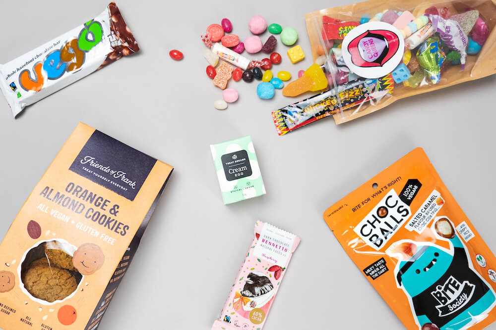 Vegan sweets flat-lay for the 20 best vegan gifts in Australia gift guide