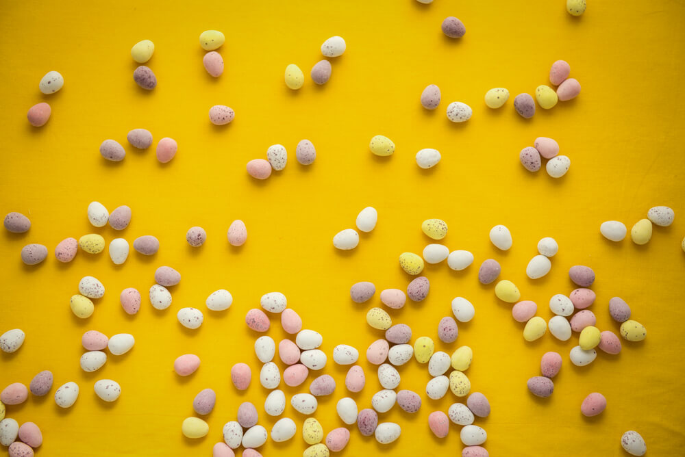 vegan easter candy flat lay on yellow