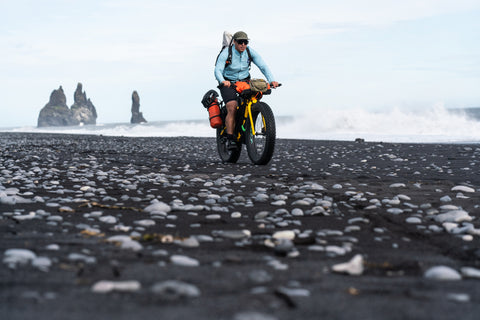 Chris Burkard riding his fatbike along the south coast of Iceland. Photo by Steve Fassbinder.