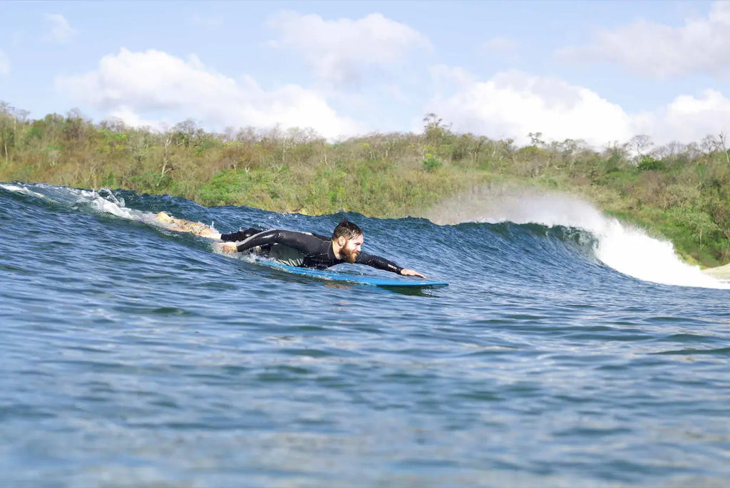 How to Paddle a Longboard and Navigate Waves