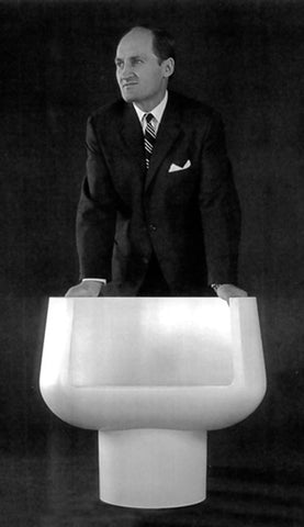 Stefan  Siwiniski  with a Plastic Chair He Designers. Image from Canadian Design Resource. 