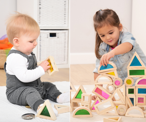 two children playing with tickit rainbow blocks